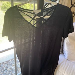 Black shirt , with crossing around chest